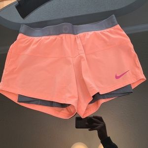 Pink nike running shorts